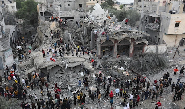 Palestinians search for survivors of the Israeli bombing in Rafah, Gaza Strip, Wednesday, Nov. 22, 2023. (AP)