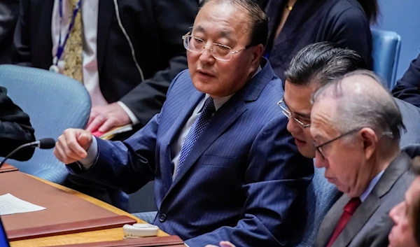 Zhang Jun, China's ambassador to the United Nations, left, attends the U.N. Security Council at United Nations headquarters Monday, Oct. 30, 2023 (AP Photo/Eduardo Munoz Alvarez)