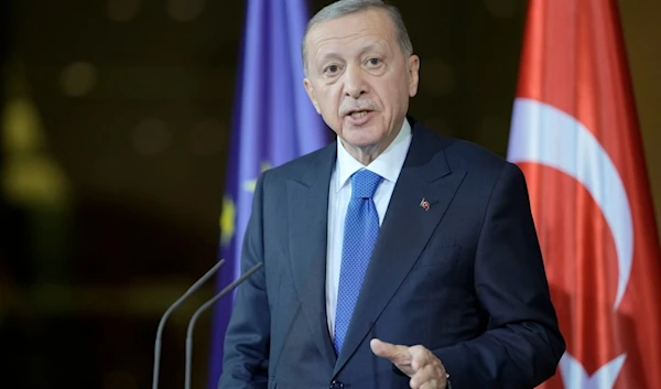 Turkey's President Recep Tayyip Erdogan talks to the media during his visit at the chancellery with German Chancellor Olaf Scholz in Berlin, Germany, Friday, Nov. 17, 2023. (AP Photo/Markus Schreiber)