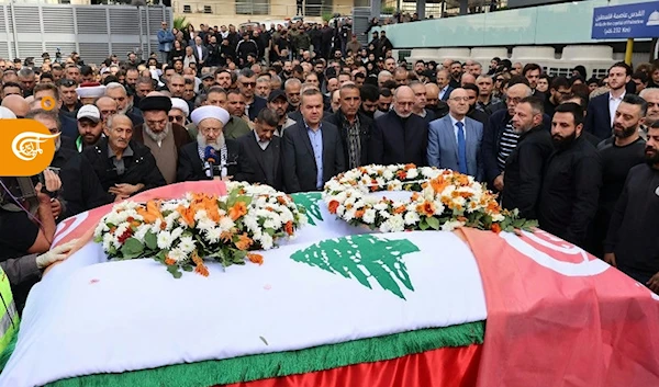 Sheikh Maher Hammoud leads prayers before the coffins of colleagues Farah Omar and Rabih Me'mari, November 22, 2023, Al Mayadeen HQ, Beirut (AP)