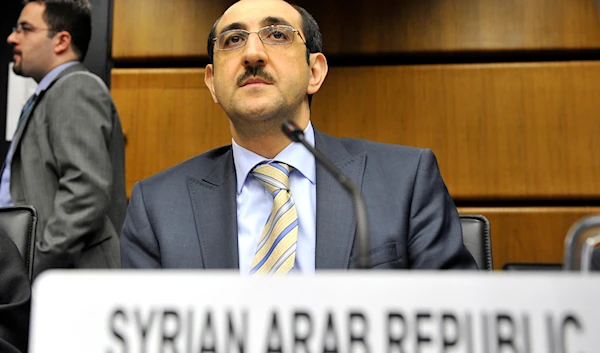 Syrian Ambassador to the International Atomic Energy Agency, IAEA, Bassam Al-Sabbagh waits for the start of the IAEA board of governors meeting at the International Center in Vienna, Austria, Wednesday, Sept. 11, 2013.  (AP)