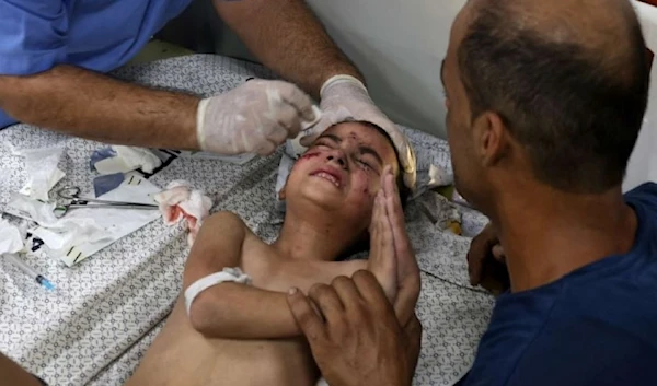 A boy is treated for injuries at a hospital in the city of Rafah, in the southern Gaza Strip, Oct.12, 2023, due to an Israeli airstrike on a residential building. ( AFP via Getty Images)