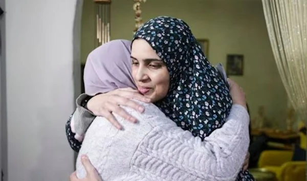 Marah Bakir, right, a former Palestinian prisoner who was released by the Israeli authorities, is welcome at her family house in the east Al-Quds neighborhood of Beit Hanina, Friday, Nov. 24, 2023. (AP)