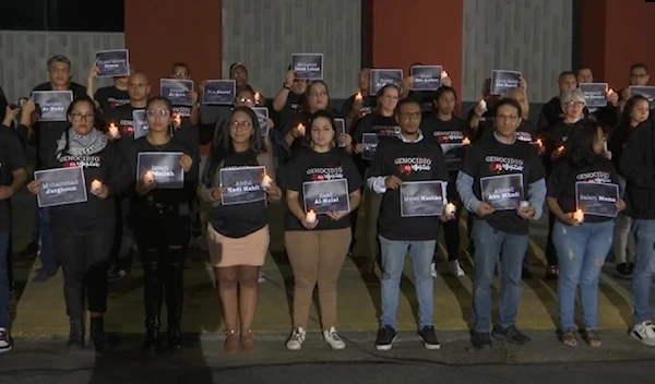 A group of journalists and activists held a vigil in front of Telesur network's building in Caracas in solidarity with Al Mayadeen's martyrs Farah Omar, Rabih Me'mari, and Hussein Akil. (Telesur)