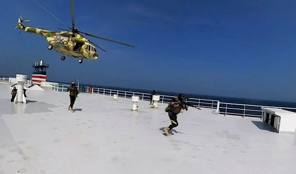 This photo released by the Houthi Media Center shows Houthi forces boarding the cargo ship Galaxy Leader on Sunday, Nov. 19, 2023. (AP)