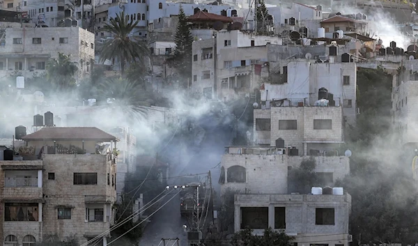 IOF vehicles enter the Jenin refugee camp in the occupied West Bank city of Jenin. (AFP)