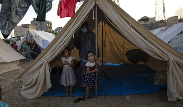 Palestinian children displaced by the Israeli bombardment of the Gaza Strip in Khan Yonis on October 19, 2023. (AP)