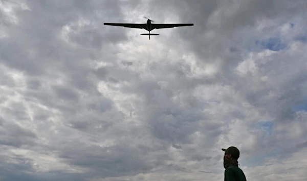 An operator controls a reusable airstrike “Punisher” drone made by the Ukrainian company UA Dynamics during a test in Kyiv region on August 11, 2023. (AFP)