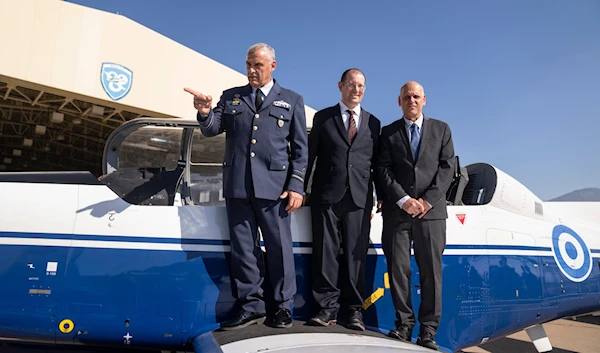 From left, Major Gen. Georgios Vagenas, commander of the Greek Air Force Training Command, Head of SIBAT Yair Kulas, President and CEO of Elbit Systems Bezhalel Machlis in Oct 2022 (AP)