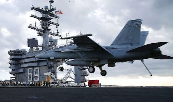 A F18 Super Hornet prepares to land on the deck of the USS Eisenhower off the coast of Virginia, December 10, 2015 in the Atlantic Ocean. (AP)