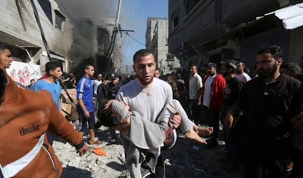 Palestinians rescue survivors after an Israeli strike on Rafah, Gaza Strip, Palestine, Friday, Nov. 17, 2023 (AP Photo/Hatem Ali)