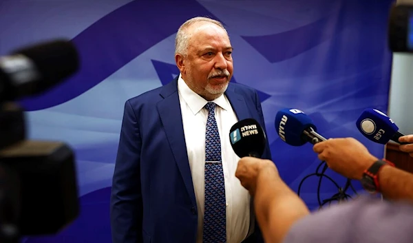 former Israeli Finance Minister Avigdor Lieberman  speaks to journalist at the weekly cabinet meeting, in Jerusalem, Sunday, Sept. 11, 2022 (AP)