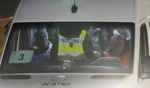 A mini-bus carrying Israeli hostages released by Hamas arrives at the at Sheba Medical Center in Ramat Gan, Israel, Tuesday, Nov. 28, 2023.