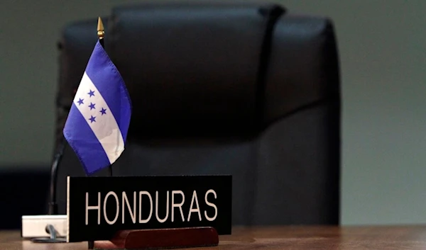 A Honduran flag is seen at the site where the next OAS General Assembly will take place in San Salvador, El Salvador, Wednesday, June 1, 2011. (AP)