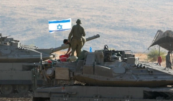 Israeli tanks are positioned in the occupied Palestinian territories near the border with Lebanon on October 15, 2023. (AFP)