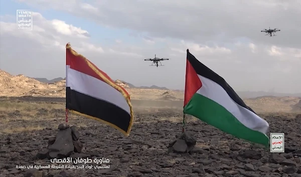 The flags of Yemen and Palestine shown as drones launch during the Yemeni Ansar Allah military drills earlier in October, 2023. (Military Media)