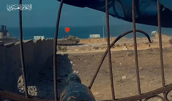 Screen Grab from a video published by the military media of the Palestinian Resistance, Al-Qassam Brigades, depicting the destruction of an Israeli Namer APC, posted on November 4, 2023 (Military Media)