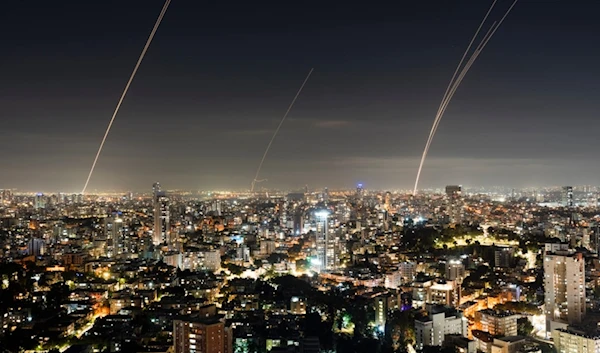 Israeli Iron Dome air defense system fires to intercept a rocket fired from the Gaza Strip, central Occupied Palestine, Saturday, Oct. 28, 2023 (AP)