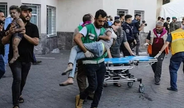 Children injured in an Israeli strike are rushed to al-Shifa hospital in Gaza City. (AFP via Getty Images)