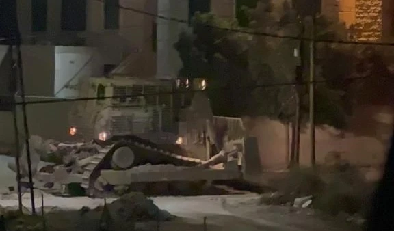 An Israeli bulldozer is destroying a road in the West Bank City of Jenin.  (Social media)