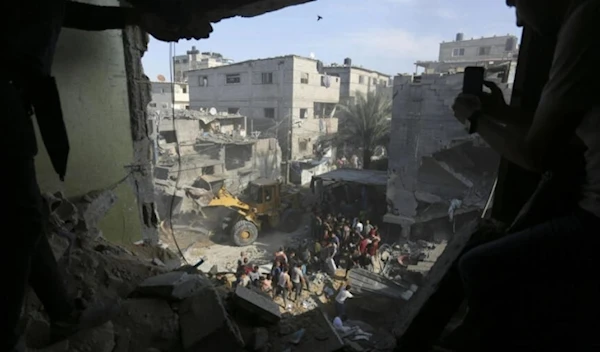 Palestinians look for survivors after an Israeli strike on the Gaza Strip in Rafah on October 30, 2023. (AP)