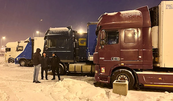 Ukrainian truck drivers wait to cross from Poland back into Ukraine in Korczowa, Poland, on Thursday Dec. 7, 2023. (AP)