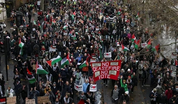 People take part in a protest in solidarity with the Palestine, in London, December 9, 2023 (Hollie Adams/Reuters)