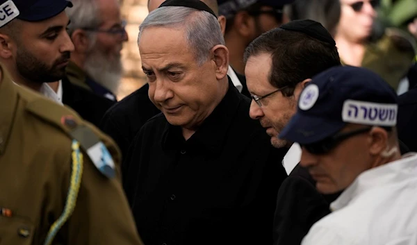 Israeli Prime Minister Benjamin Netanyahu arrive for the funeral of slain Israeli soldier, Friday, Dec.8, 2023 (AP)