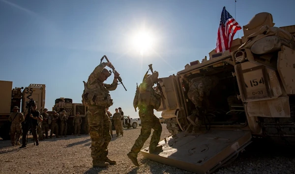 Crewmen enter Bradley fighting vehicles at a US military base in Northeastern Syria, on Nov. 11, 2019 (AP)