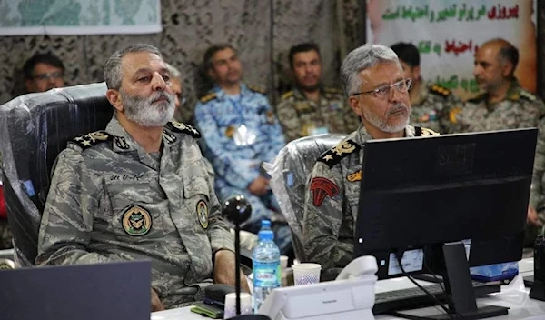 Iranian Army commander Abdolrahim Mousavi (L) and General Habibollah Sayyari (R) inaugurate the electronic warfare exercises. (Iranian state TV)