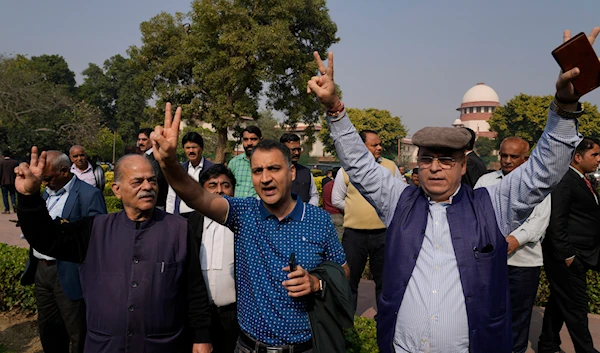 Kashmiri Hindus locally known as Pandits show victory signs in New Delhi, India, Monday, Dec. 11, 2023. (AP)