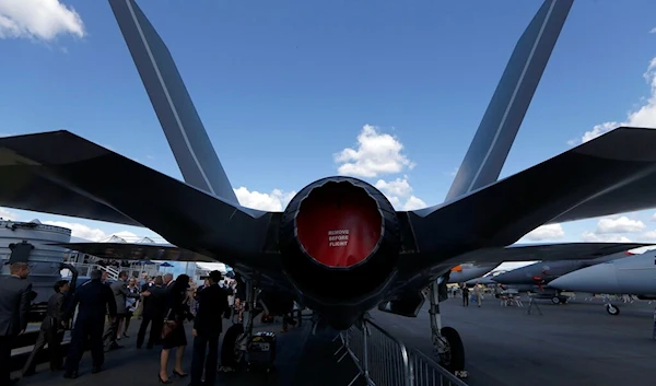 Visitors look at a full-size replica model of a Lockheed Martin multirole fighter F35 during Farnborough International Air Show, Farnborough, England, Monday, July 14, 2014 (AP)