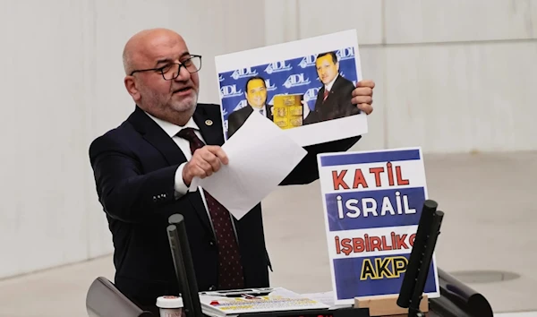 Hasan Bitmez, 53, a Turkish lawmaker from the Islamist Saadet Partisi, or Felicity Party speaks at the main chamber of  the Turkish parliament in Ankara, Thursday Dec.14. (AP)