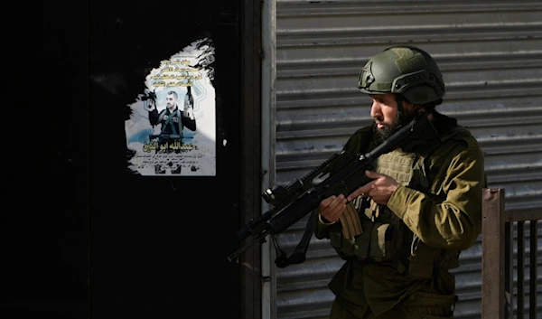 Israeli occupation forces are seen during an army operation, in the Jenin refugee camp, West Bank, Tuesday, Dec. 12, 2023. (AP)