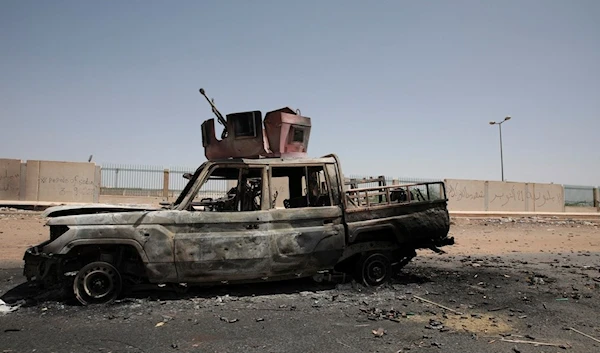 A destroyed military vehicle is seen in southern in Khartoum, Sudan, on April 20, 2023 (AP)