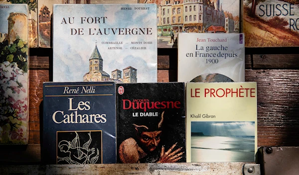 Books are displayed at a bookseller booth in Paris, Tuesday, Aug. 22, 2023. (AP)