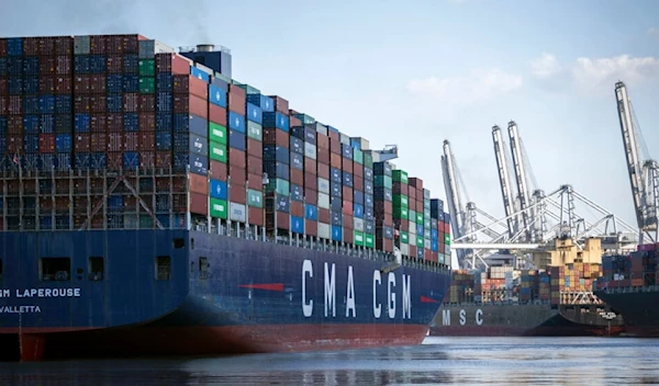 The container ship CMA CGM Laperouse, left, docks at the Georgia Ports Authority's Port of Savannah, Sept. 29, 2021, in Savannah, Ga (AP Photo/Stephen B. Morton, file)