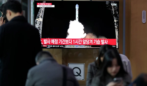 A TV screen shows a report of DPRK's a spy satellite into orbit with its third launch attempt this year, during a news program at the Seoul Railway Station in Seoul, South Korea, Nov. 22, 2023.