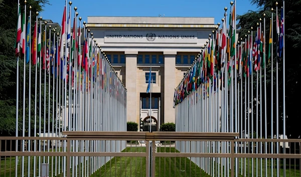 Flagpoles line in rows in front of a building of the United Nations in Geneva, Switzerland on June 14, 2021 (AP)