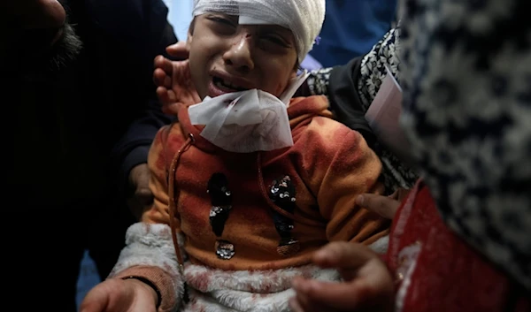 A Palestinian girl wounded in the Israeli bombardment of the Gaza Strip receives treatment at a hospital in Khan Younis on Monday, Dec. 18, 2023. (AP Photo/Mohammed Dahman)