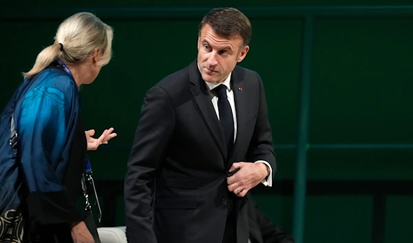 France President Emmanuel Macron attends a plenary session at the COP28 U.N. Climate Summit, Friday, Dec. 1, 2023, in Dubai, United Arab Emirates. (AP)