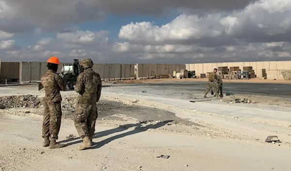 A picture taken on January 13, 2020 during a press tour organised by the US-led coalition fighting the remnants of the ISIS group, shows US soldiers clearing rubble at Ain al-Asad military airbase in the western Iraqi province of Anbar. (AFP)