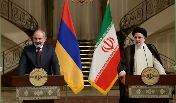 Armenian Prime Minister Nikol Pashinyan and Iranian President Ebrahim Raisi at a press conference in Tehran, Iran (Iranian presidential handout)