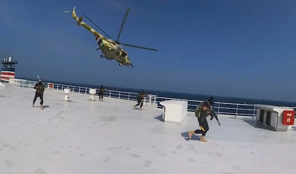 This photo released by the Houthi Media Center shows Houthi forces boarding the cargo ship Galaxy Leader on Sunday, Nov. 19, 2023. (AP)