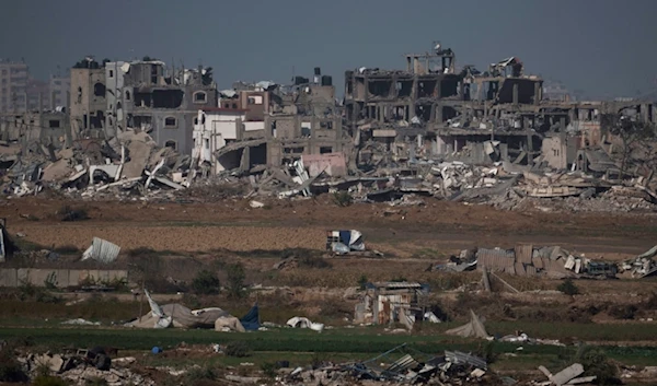 Destroyed farms and buildings in the Gaza Strip as seen from occupied Palestine's Gaza Envelope, Friday, Dec. 22, 2023. (AP)