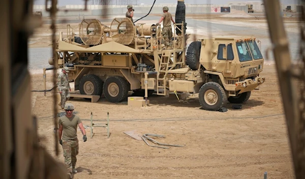 In this photo released by the U.S. Air Force, U.S. Army troops work near a Patriot missile battery at Al-Dhafra Air Base in Abu Dhabi, United Arab Emirates, May 5, 2021. (AP)