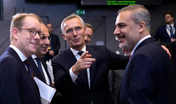 NATO Secretary General Jens Stoltenberg with Sweden's Foreign Minister Tobias Billstrom and Turkey's Foreign Minister Hakan Fidan during a meeting at NATO HQ in Brussels, on Nov. 28, 2023. (AP)