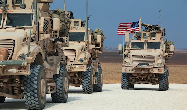 American military convoy stops near the town of Tel Tamr, north Syria, Sunday, Oct. 20, 2019. (AP)