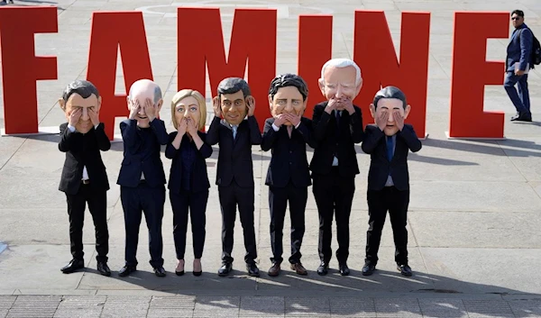 Oxfam's satirical 'big heads' of the G7 leaders pose ahead of the start of the G7 summit in Japan, in Trafalgar Square, London, Wednesday, May 17, 2023 (AP)