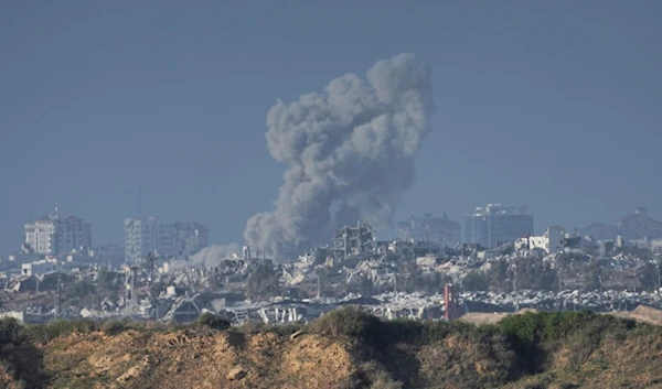 Smoke rises following an Israeli bombardment in the Gaza Strip, as seen from southern Israel, Sunday, Dec. 24, 2023 (AP Photo)